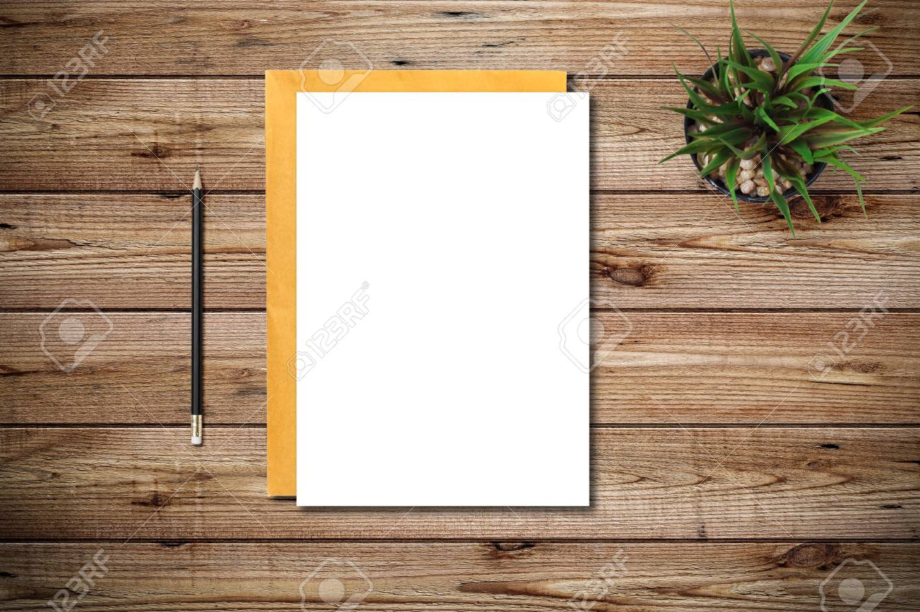 Top View Of Blank Paper Page On Wood Background Office Desk With Black  Pencil. Minimal Flat Lay Style Stock Photo, Picture and Royalty Free Image.  Image 82336753., image size:1300x865