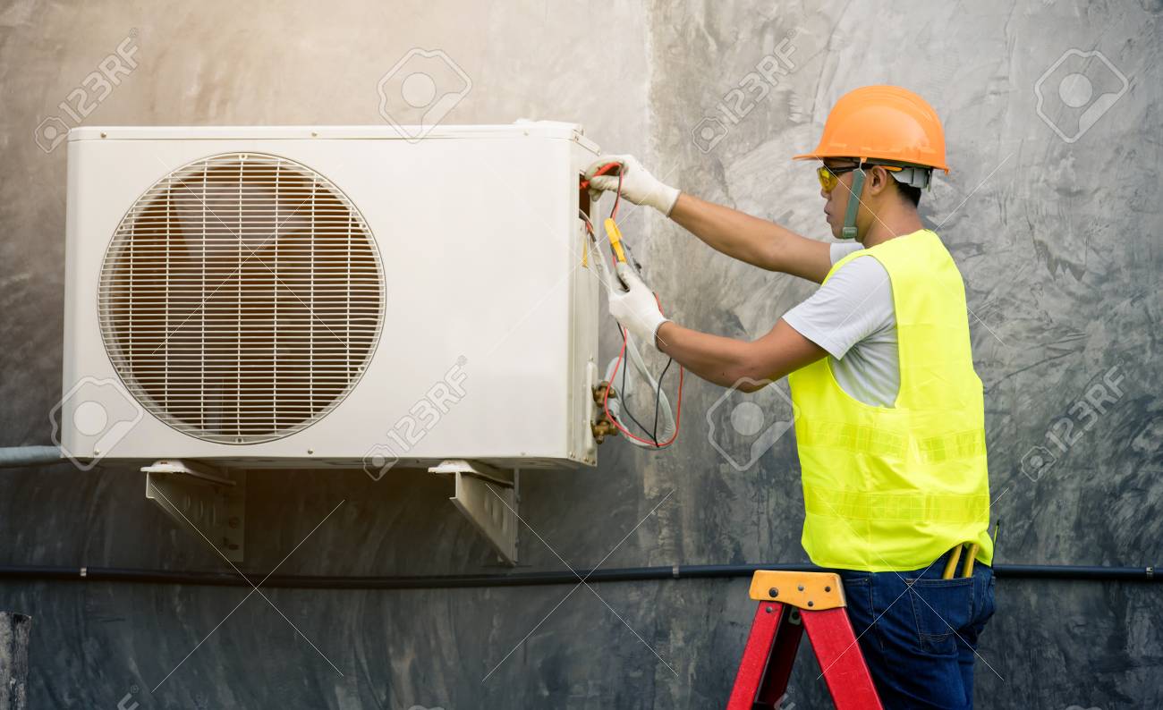 asian man runs the air-conditioning refrigerant from the tank - 111229800 asian man runs the air-conditioning refrigerant from the tank - 111229800