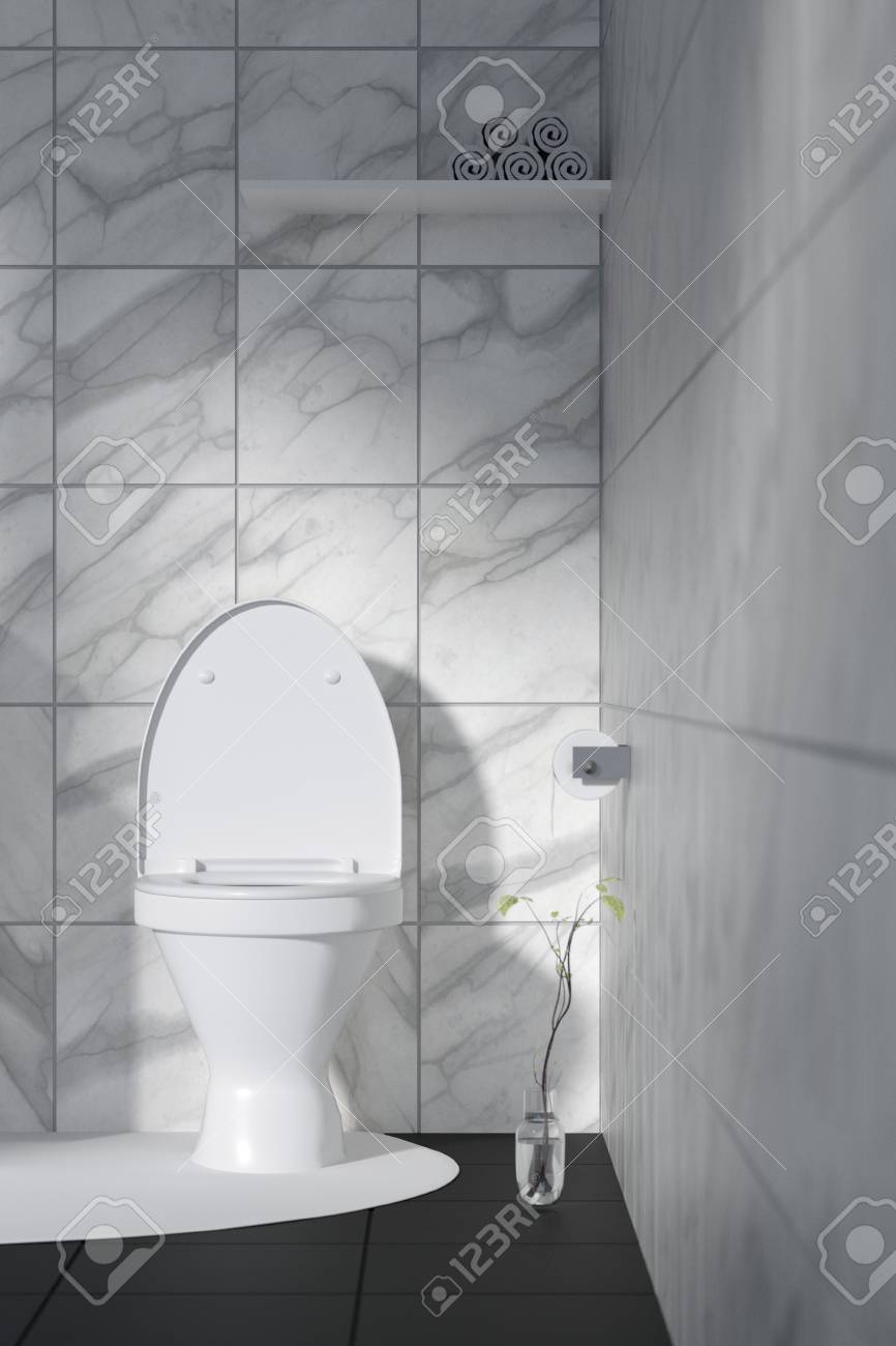 3 D レンダリング 白いトイレとバスルームには大理石のタイル壁と黒い大理石の床のイラスト ゴミに白いセラミックのボウル 黒と白のモダンなデザインの トイレ 光の外から輝く の写真素材 画像素材 Image