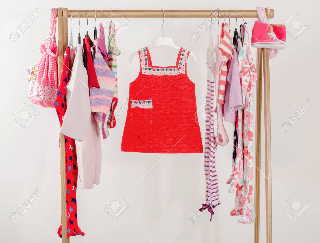 Dressing Closet With Clothes Arranged On Hangers Red Wardrobe