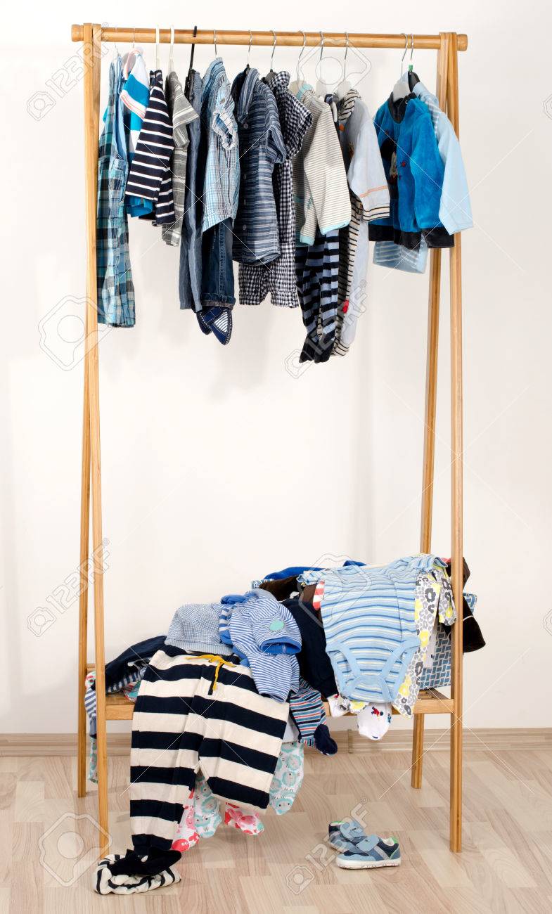 Dressing Closet With Clothes Arranged On Hangers Wardrobe Of