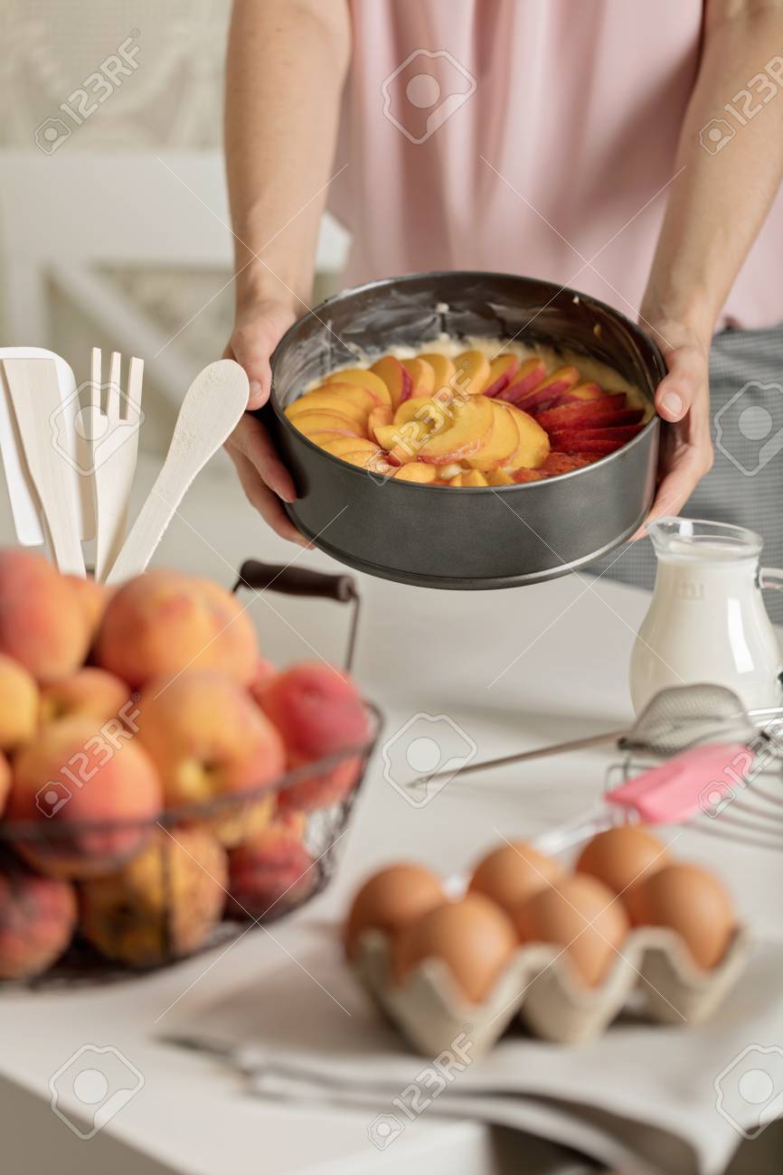 preparation of homemade peach pie kitchen accessories and products female hands in the frame - Homemade Pie Kitchen preparation of homemade peach pie kitchen accessories and products female hands in the frame - Homemade Pie Kitchen
