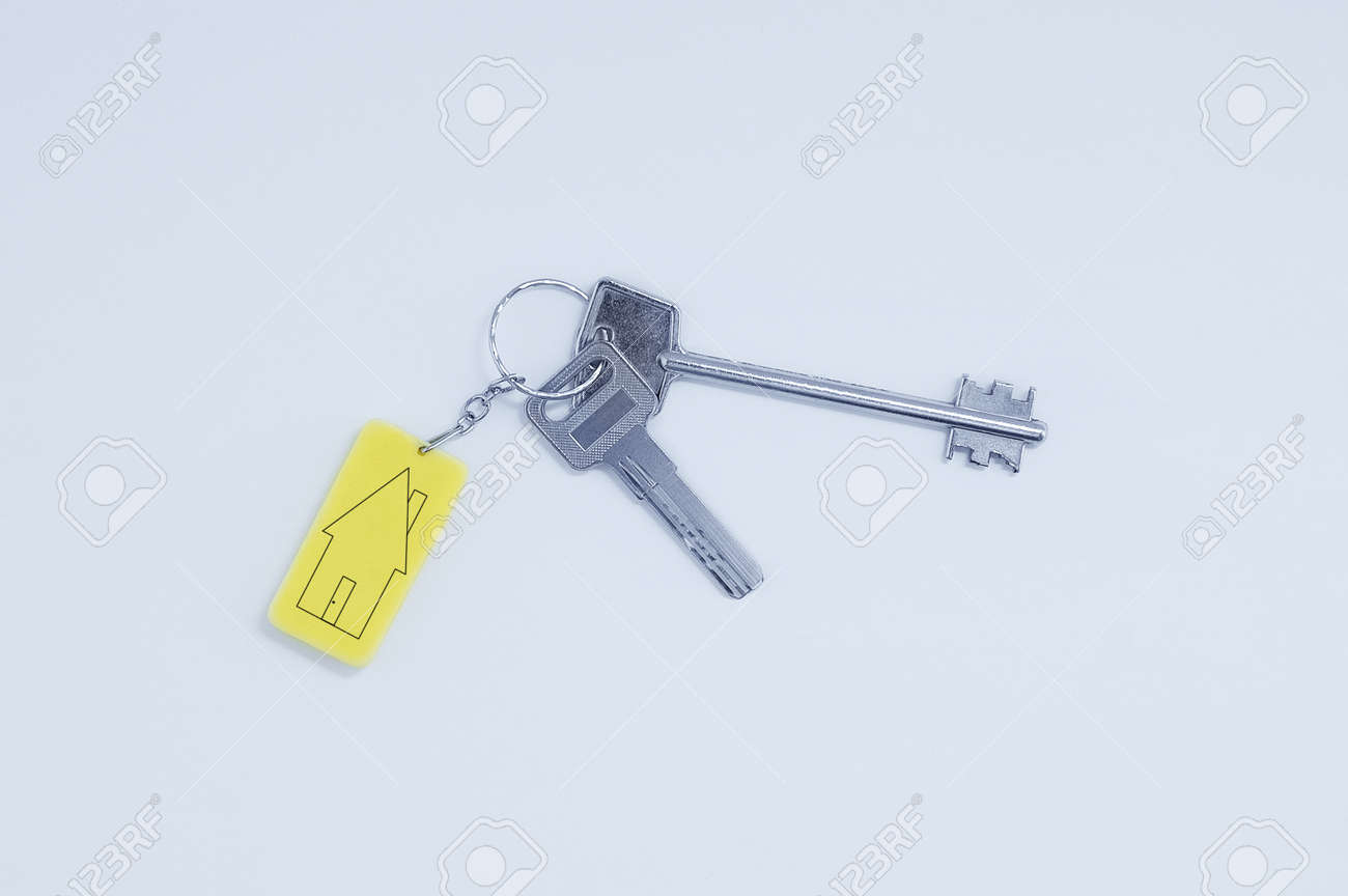 Real estate concept. Keychain with keys with black lines sketch of a house. - 171572989 Real estate concept. Keychain with keys with black lines sketch of a house. - 171572989