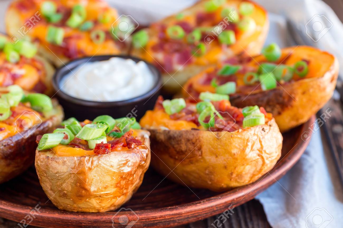 Baked Loaded Potato Skins With Cheddar Cheese And Bacon Garnished Stock Photo Picture And Royalty Free Image Image