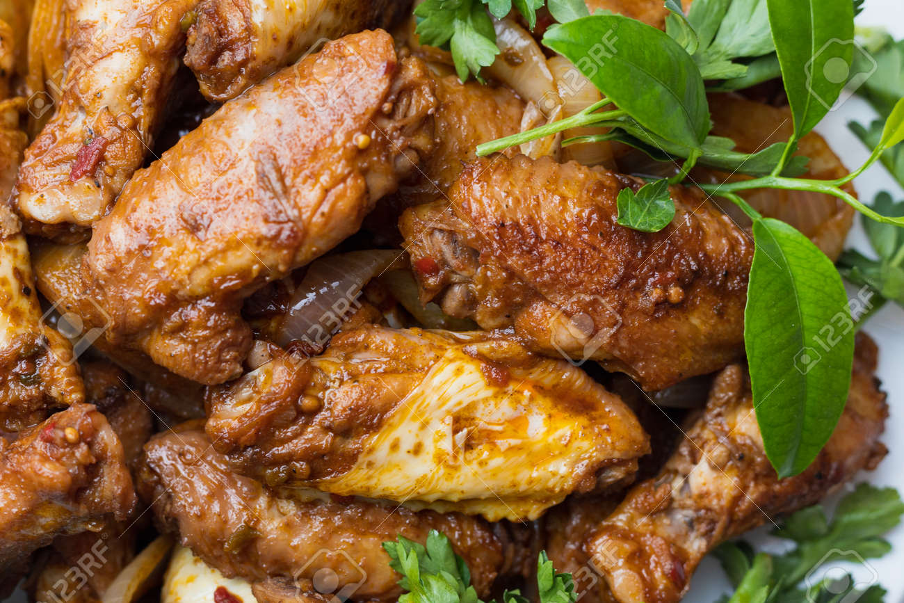Fried chicken wings. A dish for preparing dinner for beer or wine at home. Selective focus. Background - 167084232 Fried chicken wings. A dish for preparing dinner for beer or wine at home. Selective focus. Background - 167084232