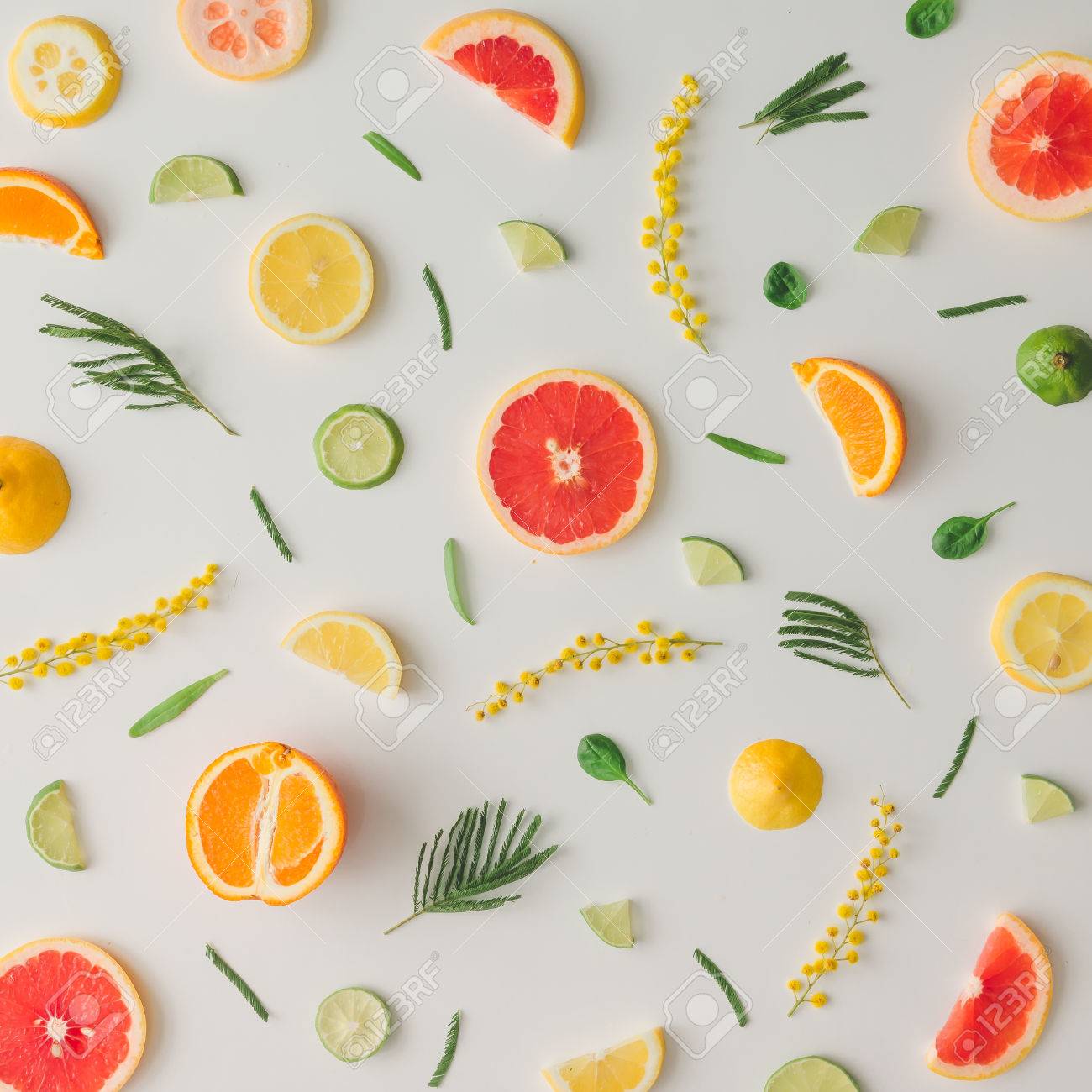 Colorful food pattern made of lemon, orange, grapefruit and flowers. Flat lay. - 73341852 Colorful food pattern made of lemon, orange, grapefruit and flowers. Flat lay. - 73341852