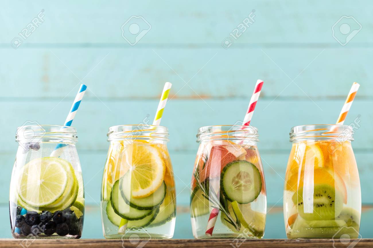 Variety of fruit infused detox water in jars for a healthy diet eating - 72813867 Variety of fruit infused detox water in jars for a healthy diet eating - 72813867
