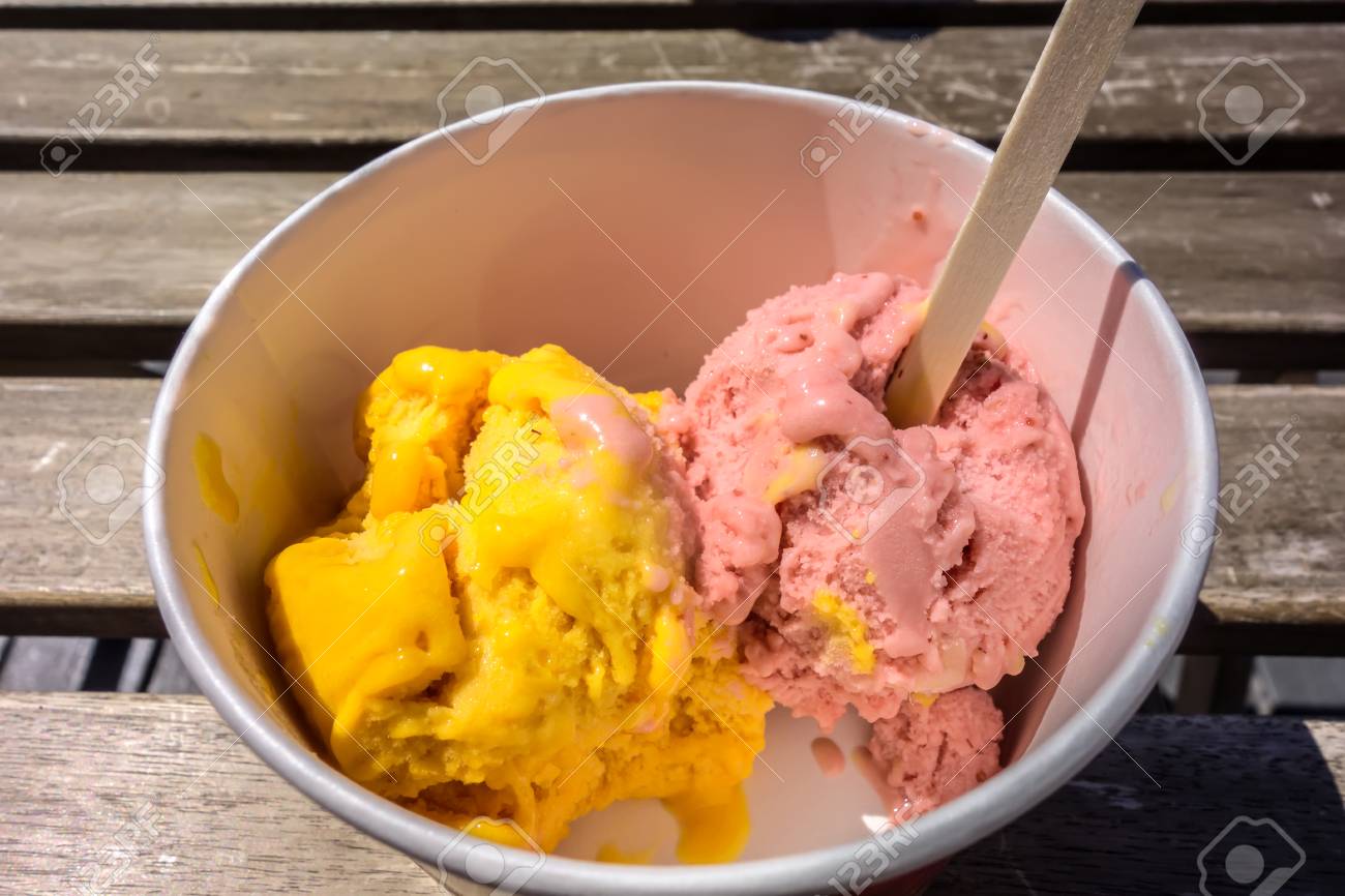 Download Bright Yellow And Pink Bals Of Ice Cream In A White Paper Cup Stock Photo Picture And Royalty Free Image Image 116635368 Yellowimages Mockups