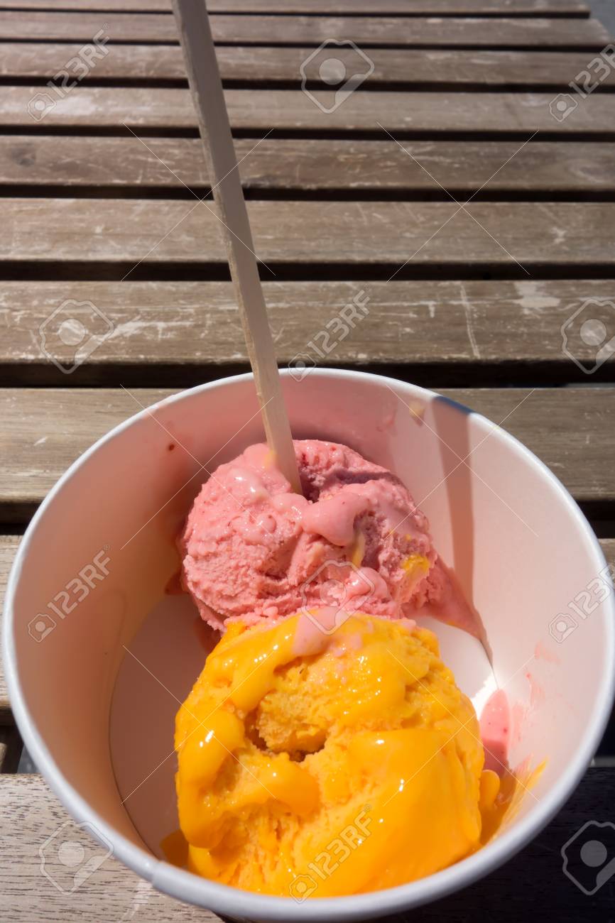 Download Bright Yellow And Pink Bals Of Ice Cream In A White Paper Cup Stock Photo Picture And Royalty Free Image Image 116635369 Yellowimages Mockups