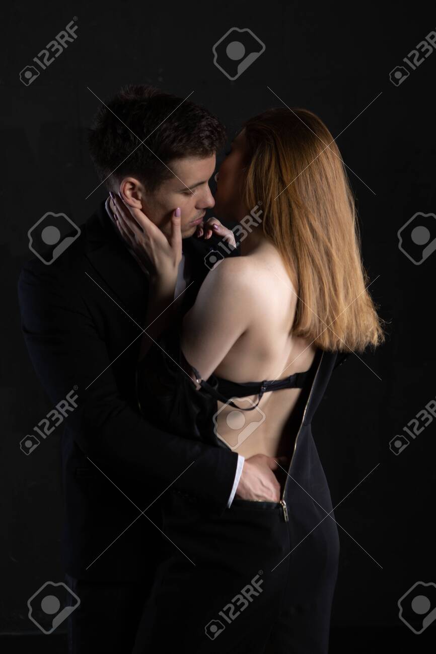 IVANOV DENISElegant Man In A Suit Gently Undresses