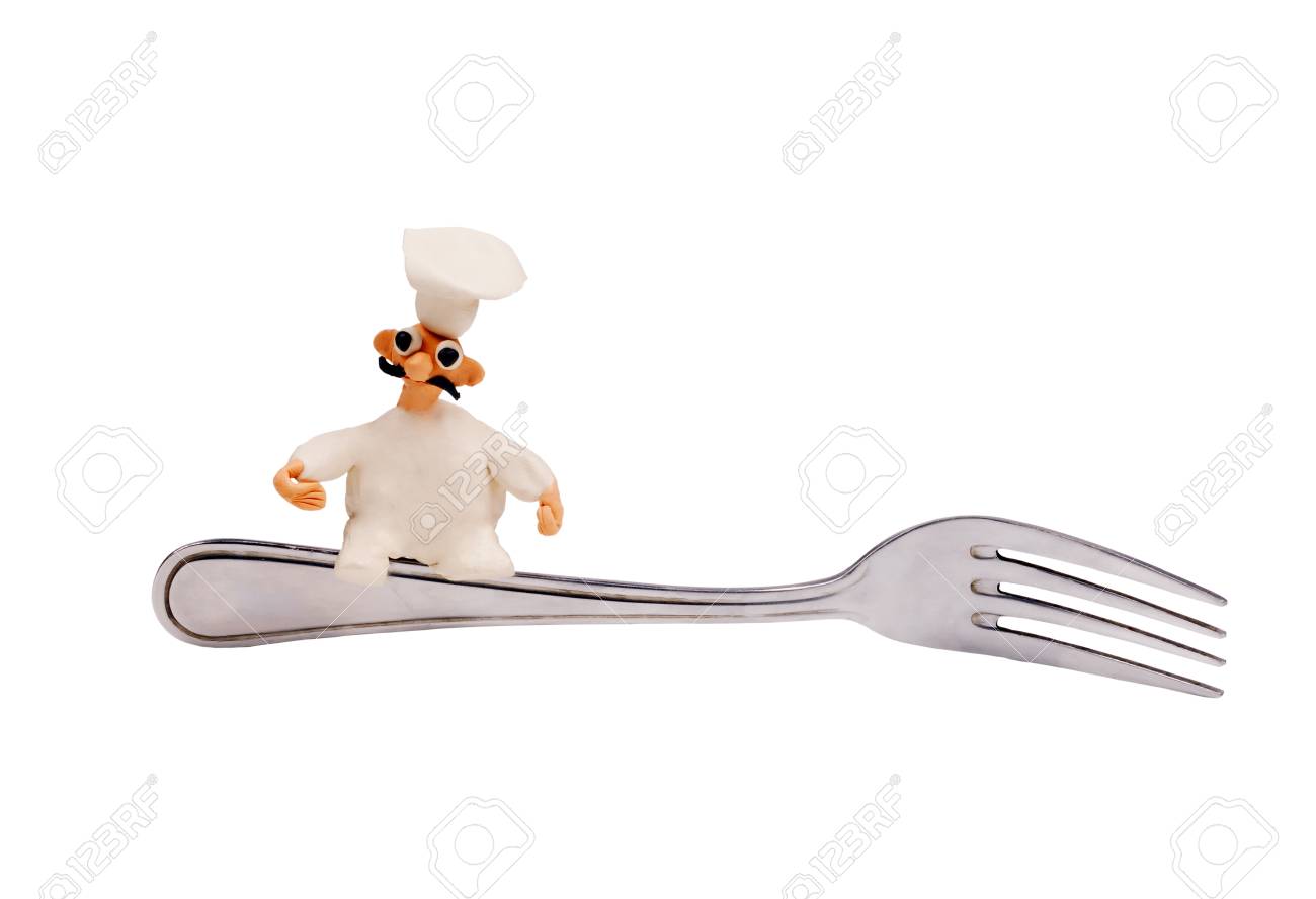 little cheerful chef made of plasticine sitting on a fork - 22458983 little cheerful chef made of plasticine sitting on a fork - 22458983