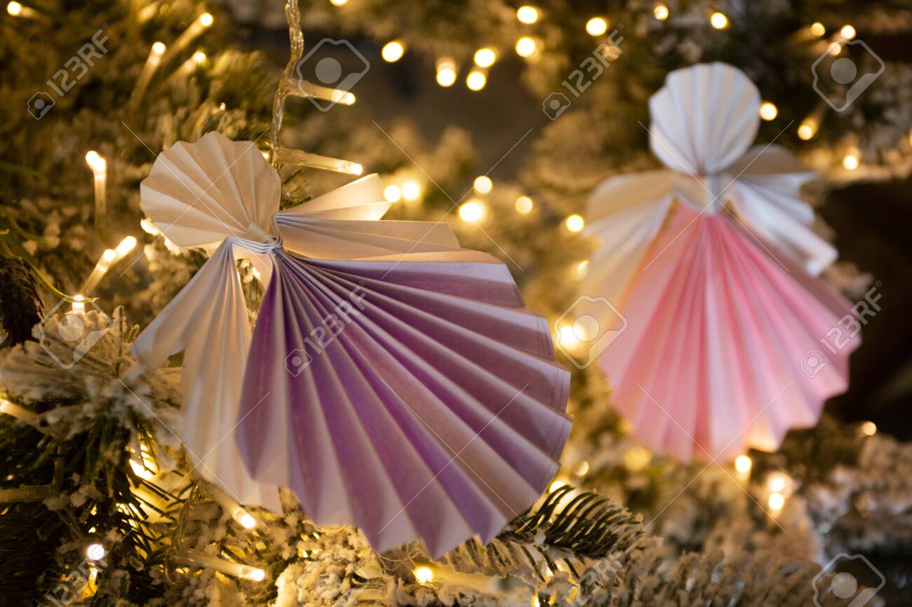 New Year Handmade Angel Origami Figures On Christmas Tree With