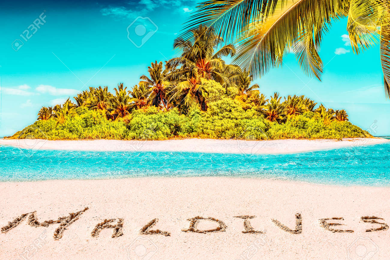 Whole tropical island within atoll in tropical Ocean. Uninhabited and wild subtropical isle with palm trees. Inscription "Maldives" in the sand on a tropical island, Maldives. - 168259298 Whole tropical island within atoll in tropical Ocean. Uninhabited and wild subtropical isle with palm trees. Inscription "Maldives" in the sand on a tropical island, Maldives. - 168259298
