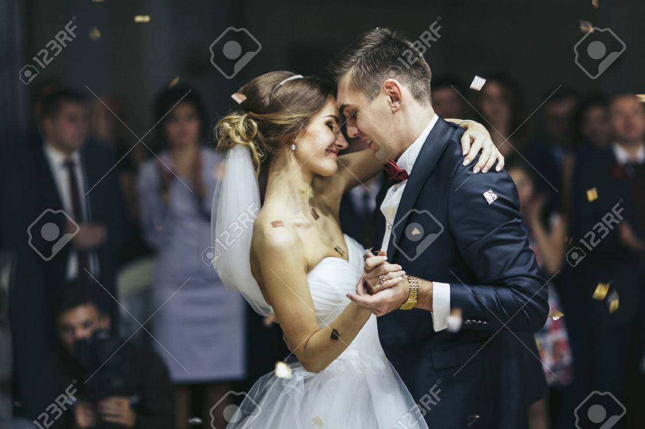 Just married looks romantically while dancing - 64224575 Just married looks romantically while dancing - 64224575