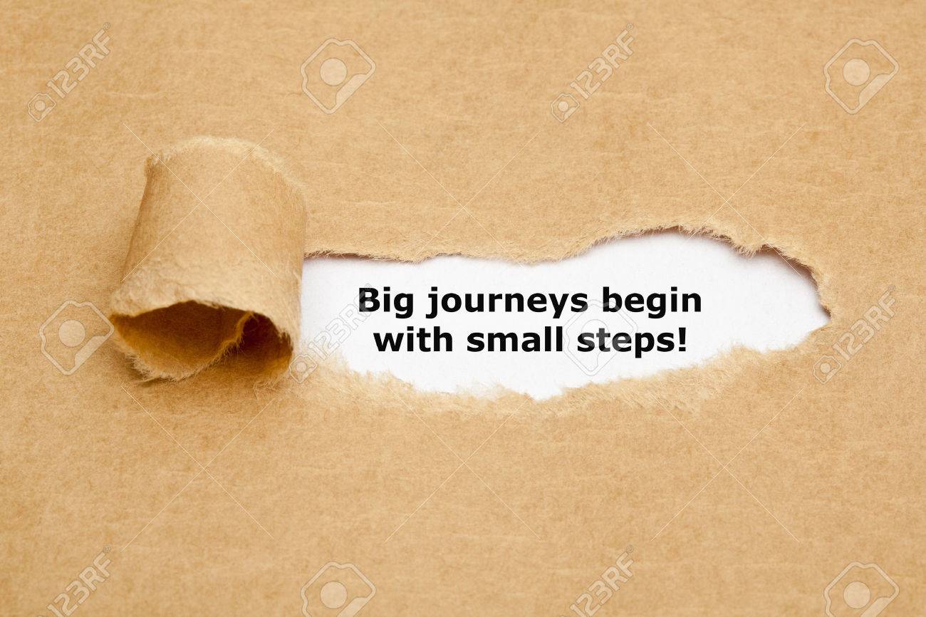 The motivational quote Big journeys begin with small steps, appearing behind torn brown paper. - 50888045 The motivational quote Big journeys begin with small steps, appearing behind torn brown paper. - 50888045