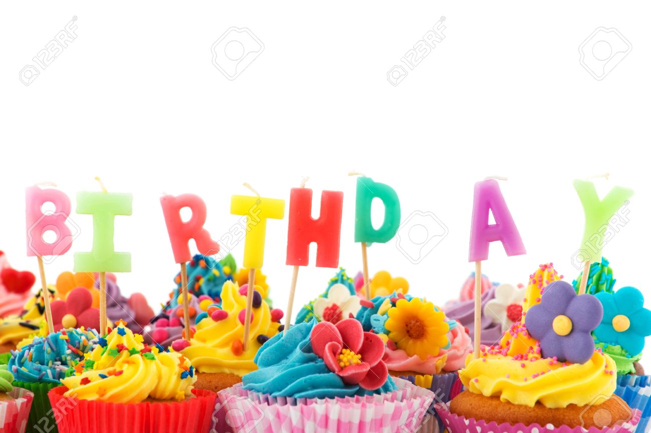 Colorful Birthday Cupcakes With Candles Isolated Over White Background Stock Photo Colorful Birthday Cupcakes With Candles Isolated Over White Background Stock Photo