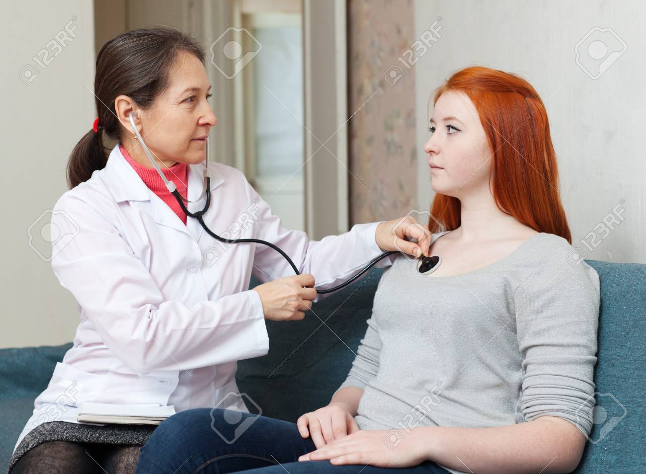 Doctor Examining Teen Girl Doctor Examining Teen Girl