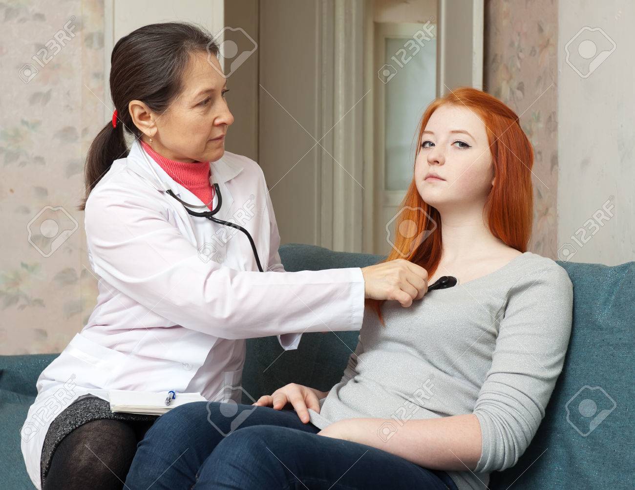 Doctor Examining Teen Girl Doctor Examining Teen Girl
