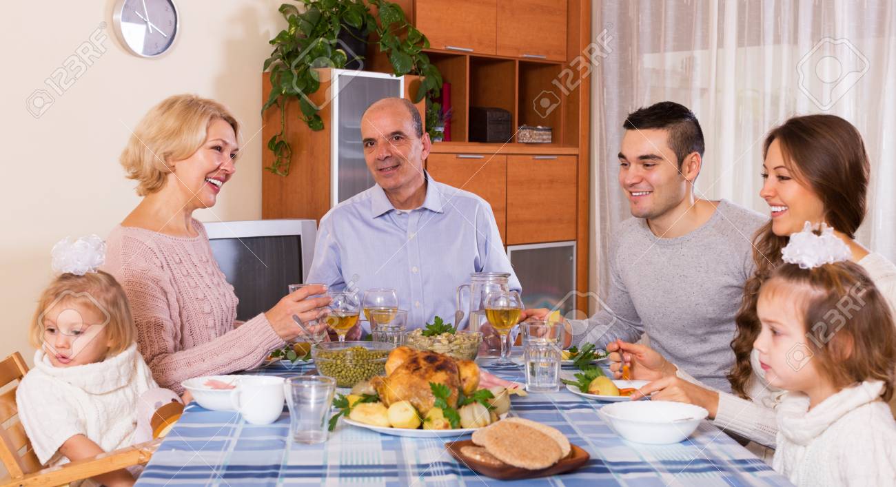 Multigenerational positive family having lunch together at room - 41188651 Multigenerational positive family having lunch together at room - 41188651