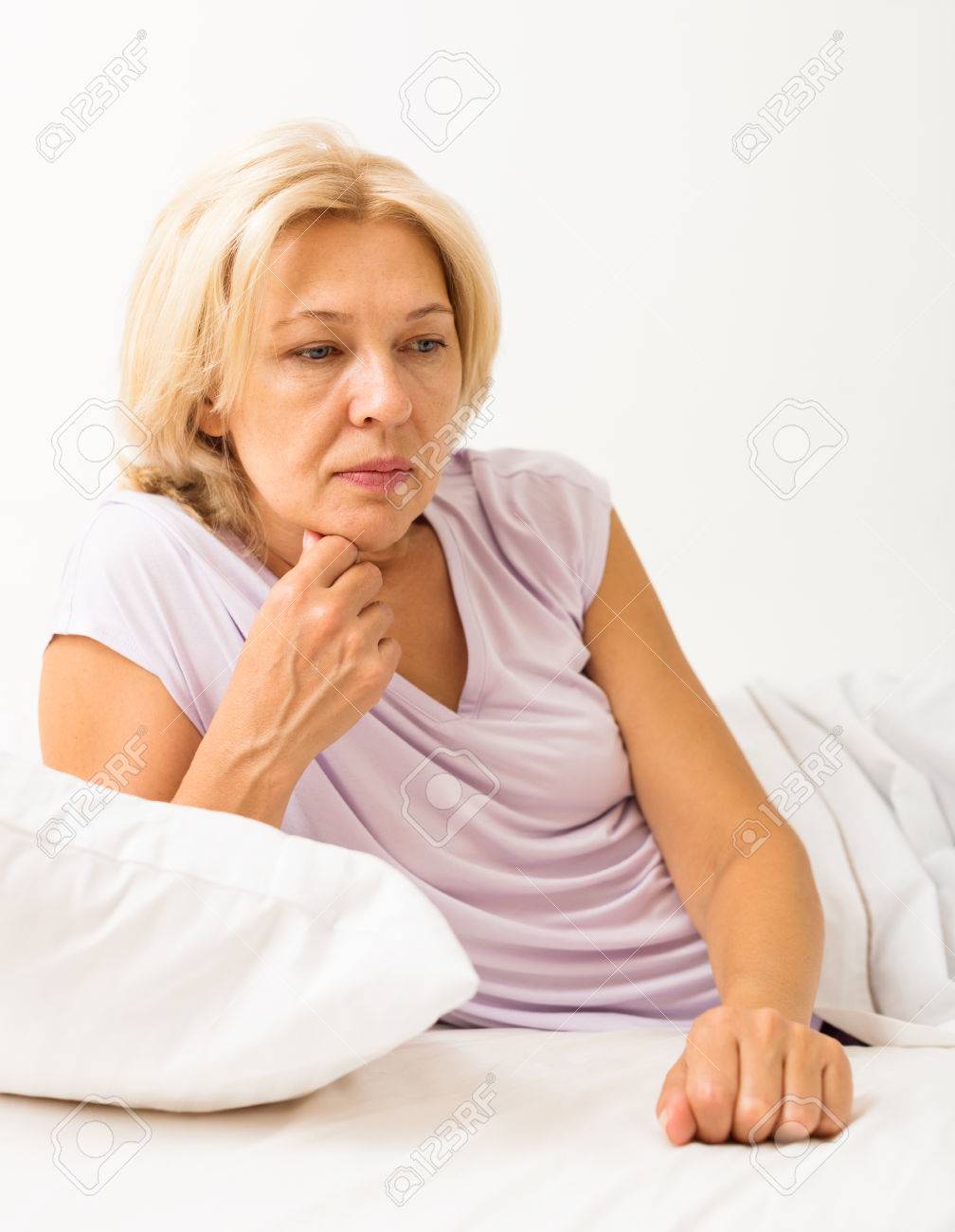 Iakov FilimonovUpset Mature Woman Laying In Bed With