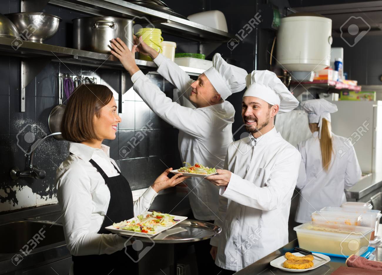 Young Female Waiter Taking Ordered Dishes From Restaurant S Kitchen Stock Photo Picture And Royalty Free Image Image 81598112