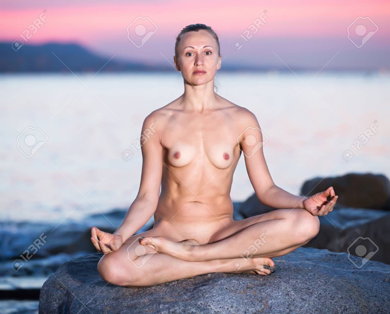 Cross-legged Nude Young European Female Practice Yoga At Sunset Sea Shore  Stock Photo, Picture and Royalty Free Image. Image 96304852.