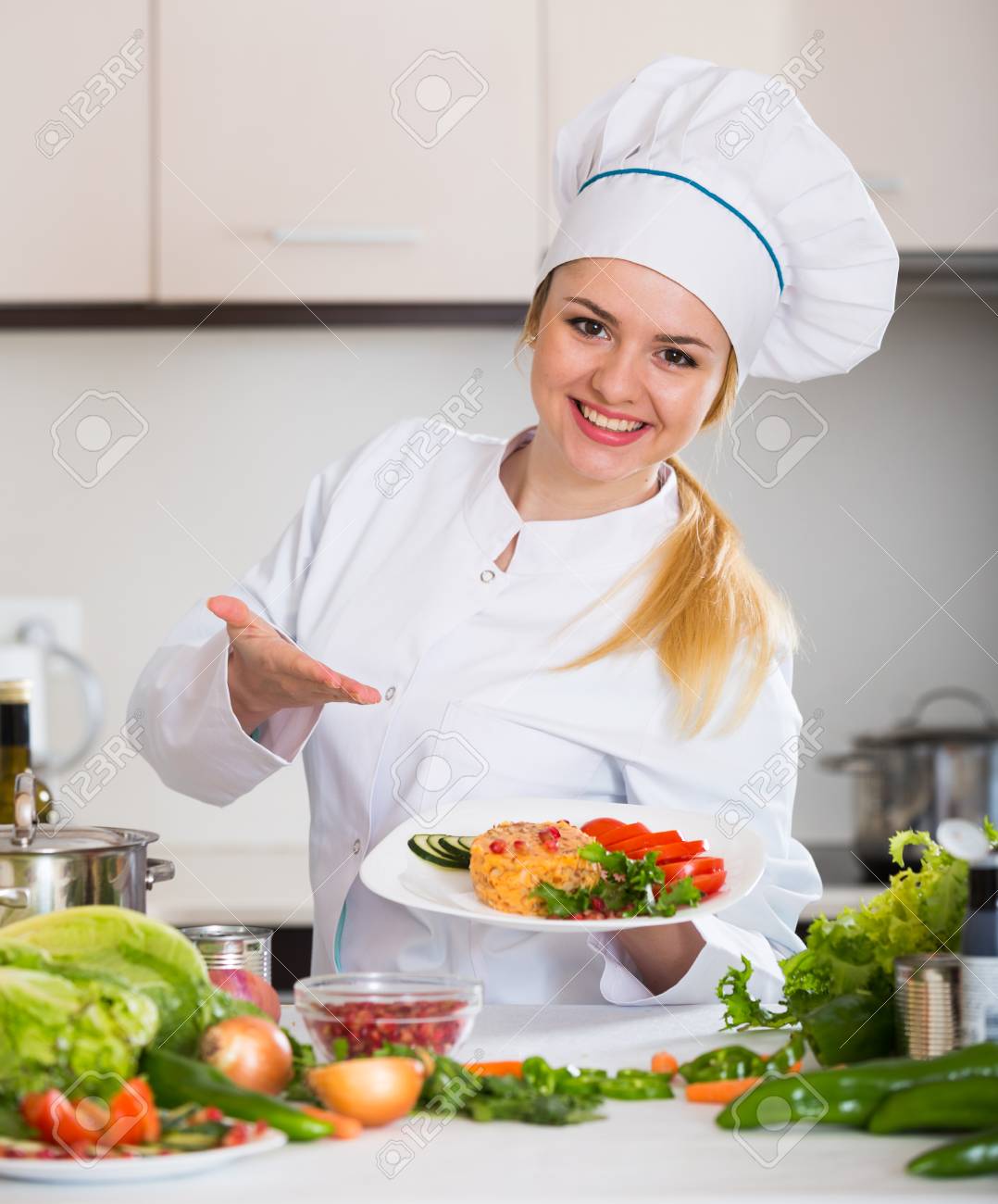 Positive Female Chef Posing With Plate Of Salad And Cheese Stock Photo,  Picture and Royalty Free Image. Image 97754076., image size:1078x1300