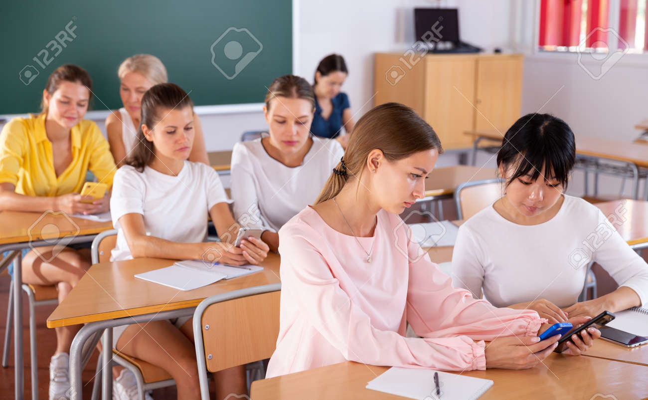 Students Working In Pairs Using Phones Stock Photo Picture And Royalty Free Image Image 157513166