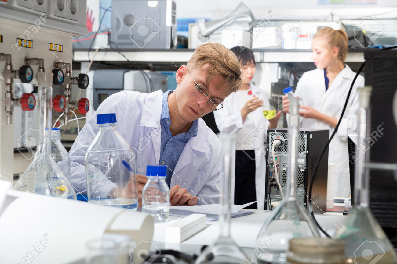 Male scientist working at biochemical laboratory - 168116728 Male scientist working at biochemical laboratory - 168116728