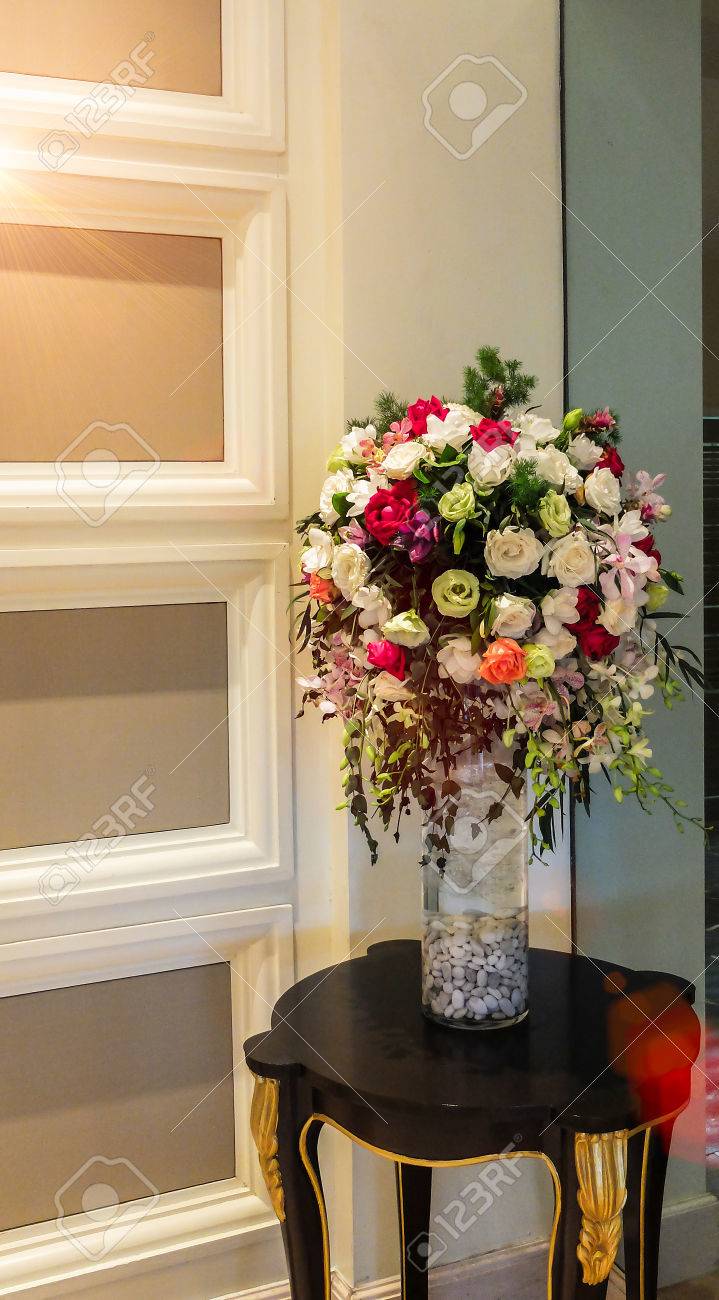 Beautiful Flower Vase At The Corner On Dark Brown Wooden Table With  Copyspace To Input Text Used As Template Stock Photo, Picture And Royalty  Free Image. Image 81201711.