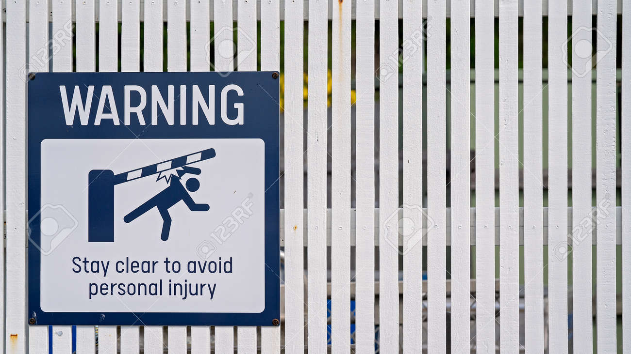 Warning Sign To Stay Clear Of Boom Gate To Avoid Personal Injury Stock Photo Picture And Royalty Free Image Image 163351561