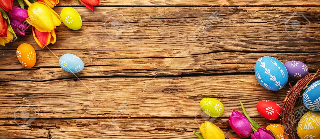 Easter eggs with tulips on wooden board, easter holiday concept. Copyspace for text. - 70485346 Easter eggs with tulips on wooden board, easter holiday concept. Copyspace for text. - 70485346
