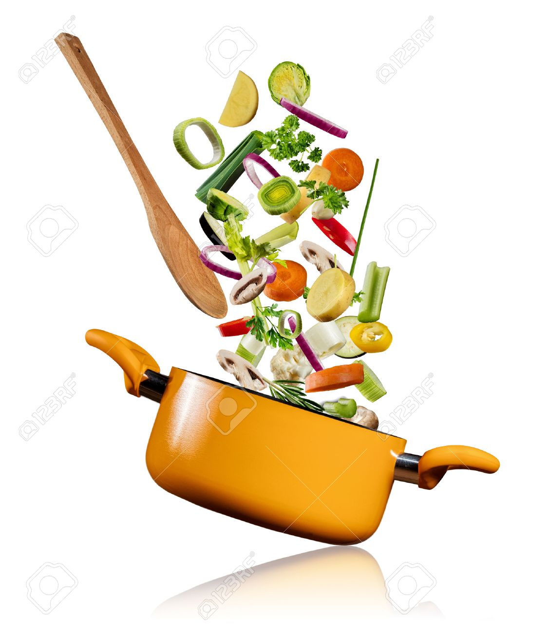 Fresh vegetables flying into a pot with wooden spoon, isolated on white background - 73597089 Fresh vegetables flying into a pot with wooden spoon, isolated on white background - 73597089