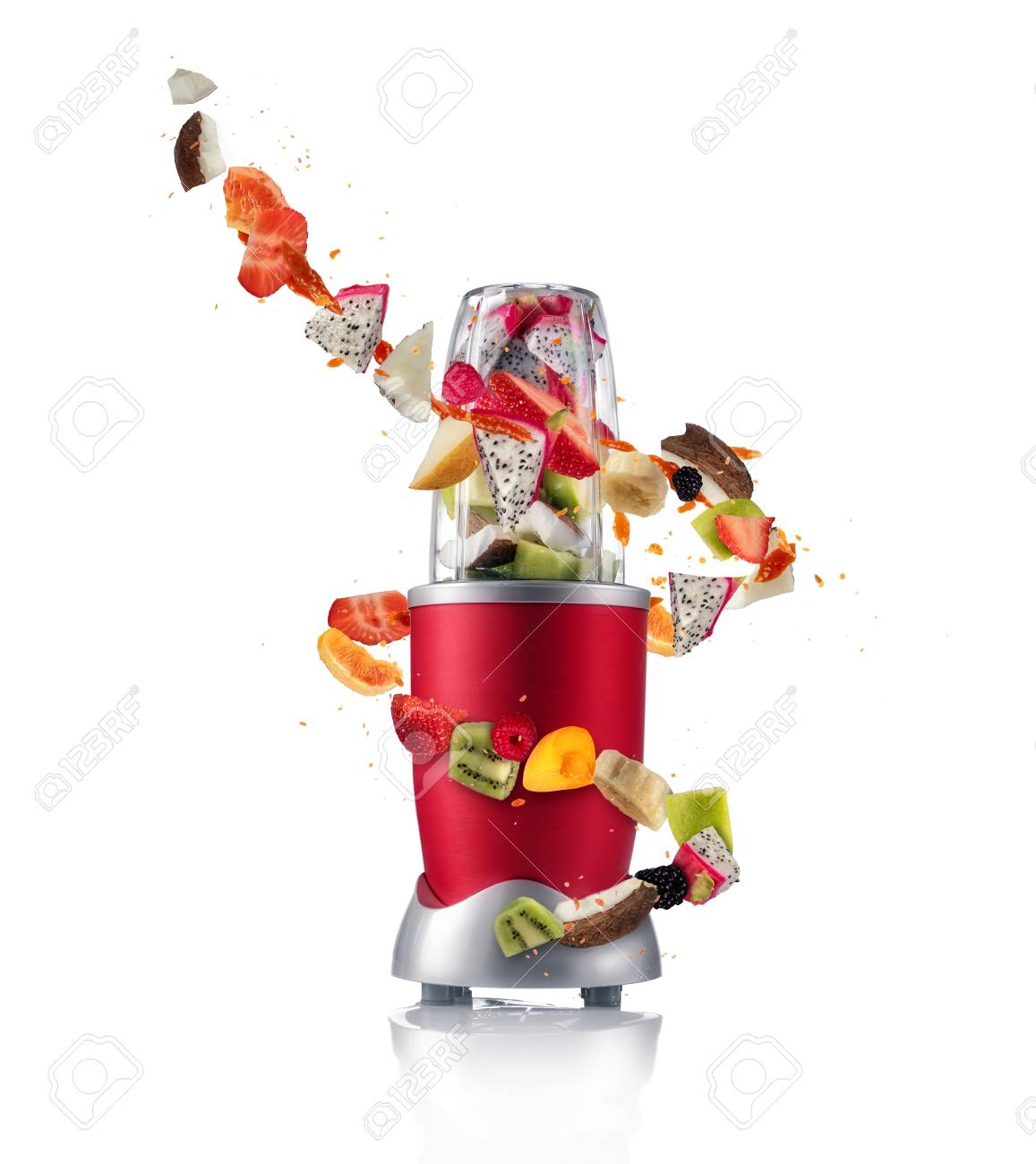 Smoothie maker mixer with pieces of fruit ingredients, isolated on white background. Healthy drink and lifestyle - 97362753 Smoothie maker mixer with pieces of fruit ingredients, isolated on white background. Healthy drink and lifestyle - 97362753