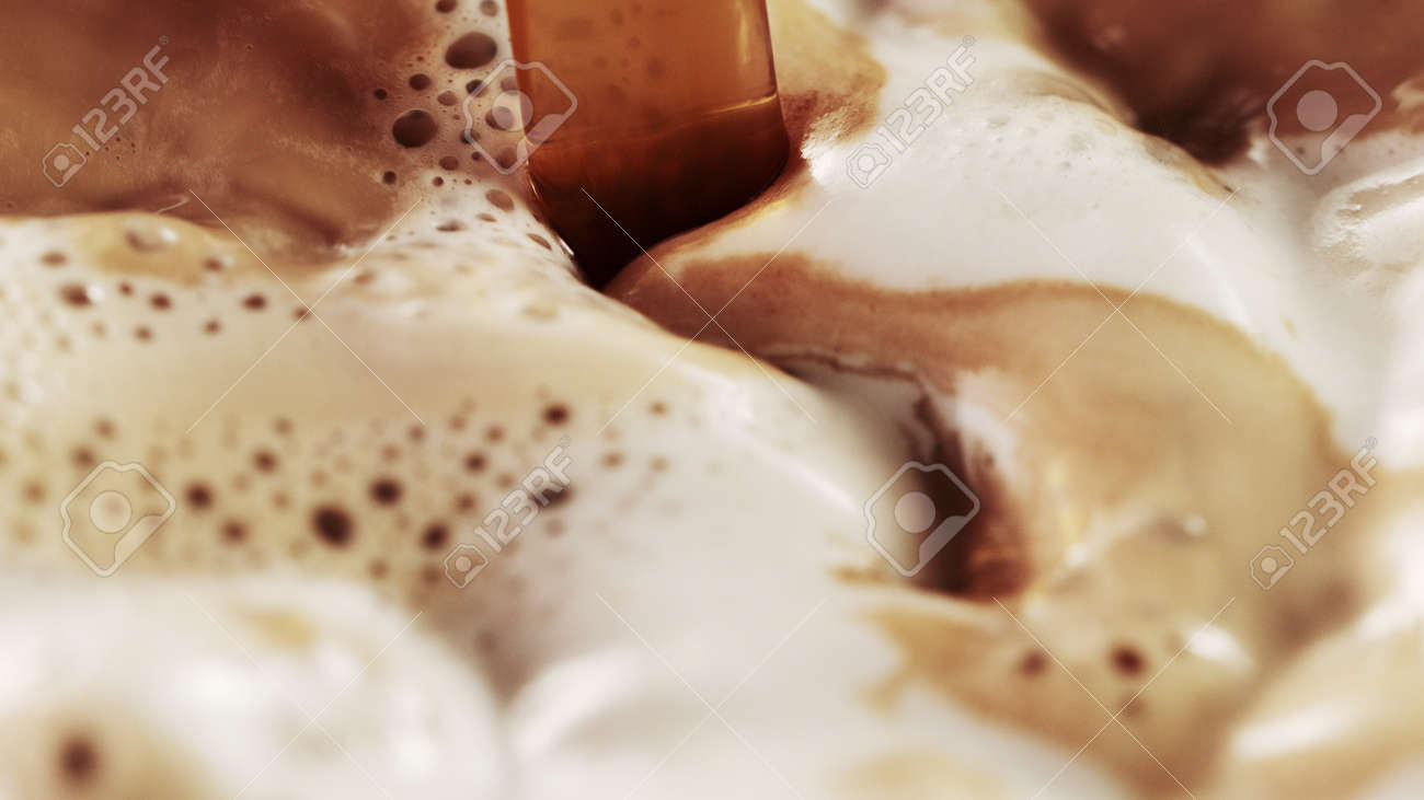 Detail of coffee drink being pour into foamy coffee drink. Abstract coffee background. - 168969971 Detail of coffee drink being pour into foamy coffee drink. Abstract coffee background. - 168969971