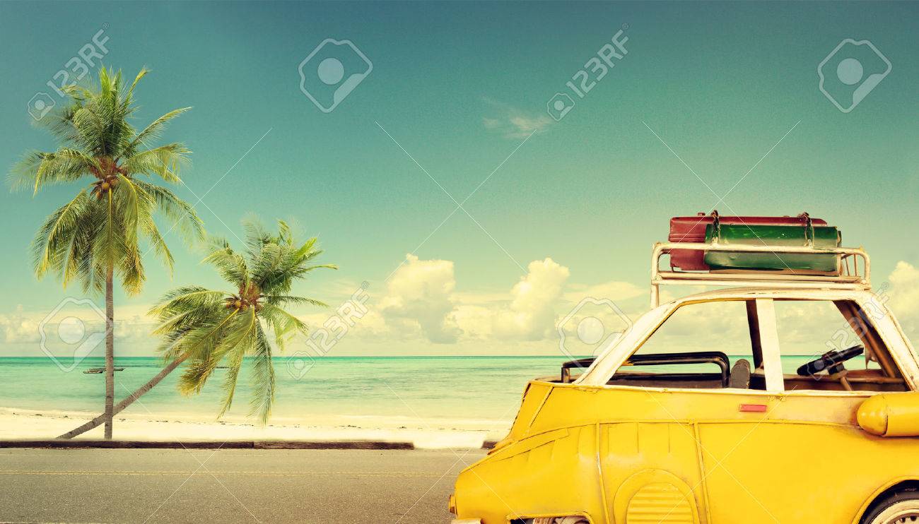 Travel destination: vintage classic car parked near the beach with bags on a roof - Honeymoon trip in summer - 50571703 Travel destination: vintage classic car parked near the beach with bags on a roof - Honeymoon trip in summer - 50571703