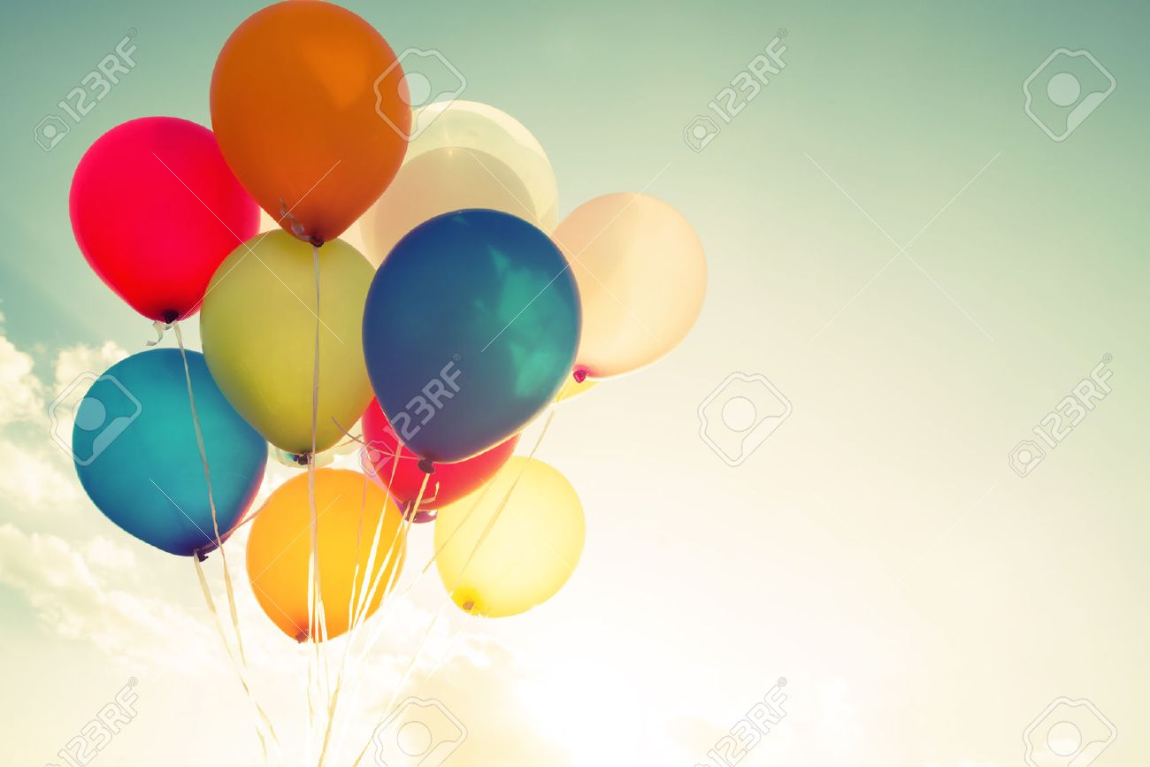multicolor balloons with a retro filter effect concept of happy balloon effect