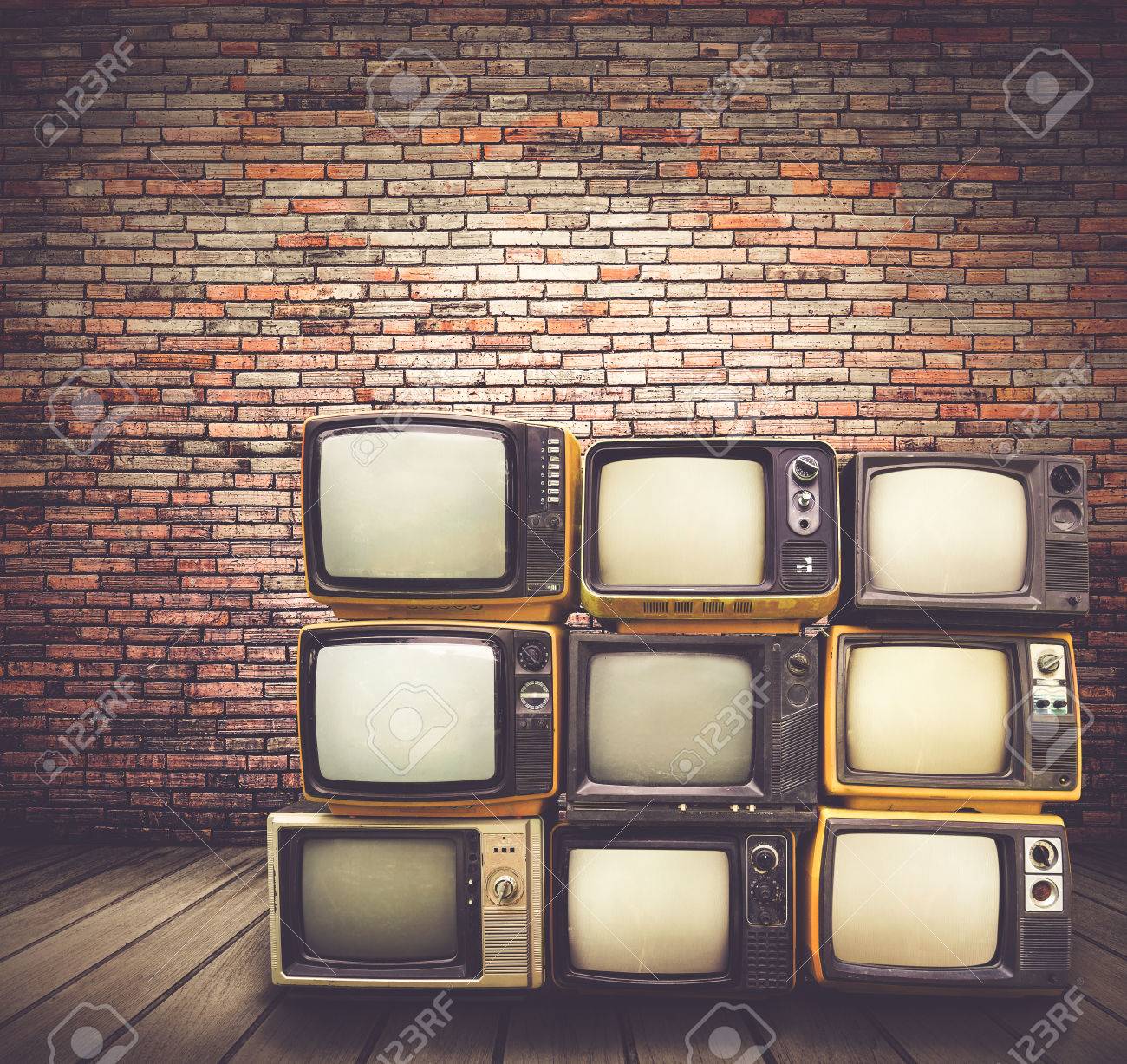 antique and vintage style photo retro televisions pile on floor