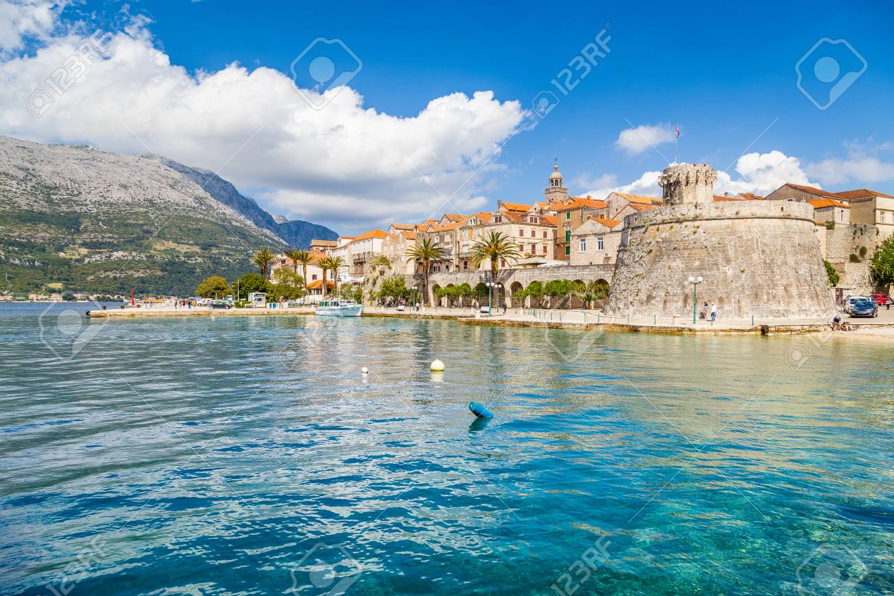 Beautiful view of the historic town of Korcula on a beautiful sunny day with blue sky and clouds in summer, Island of Korcula, Dalmatia, Croatia - 100156315 Beautiful view of the historic town of Korcula on a beautiful sunny day with blue sky and clouds in summer, Island of Korcula, Dalmatia, Croatia - 100156315
