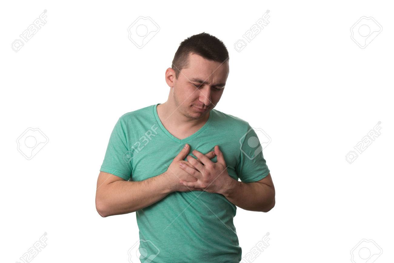 Young Man Holding A Hand To His Heart Due To This Pain Over Stock Photo Picture And Royalty Free Image Image 37864678