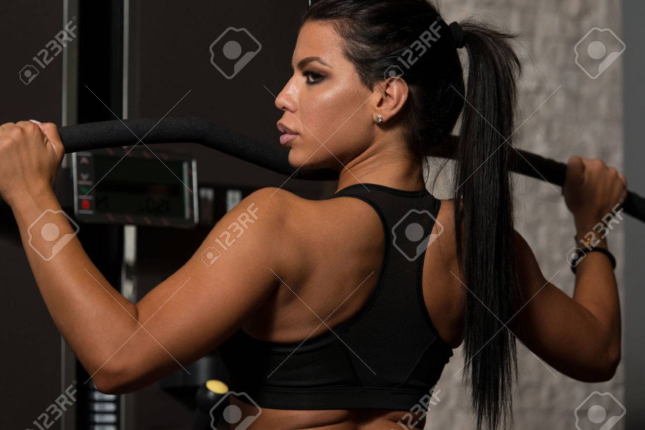 Sexy Latino Woman Working Out Back On Machine In Fitness Center Stock Photo 50219446 Sexy Latino Woman Working Out Back On Machine In Fitness Center Stock Photo 50219446