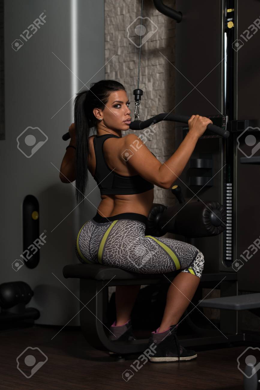 Sexy Latino Woman Working Out Back On Machine In Fitness Center Stock Photo 50219706 Sexy Latino Woman Working Out Back On Machine In Fitness Center Stock Photo 50219706