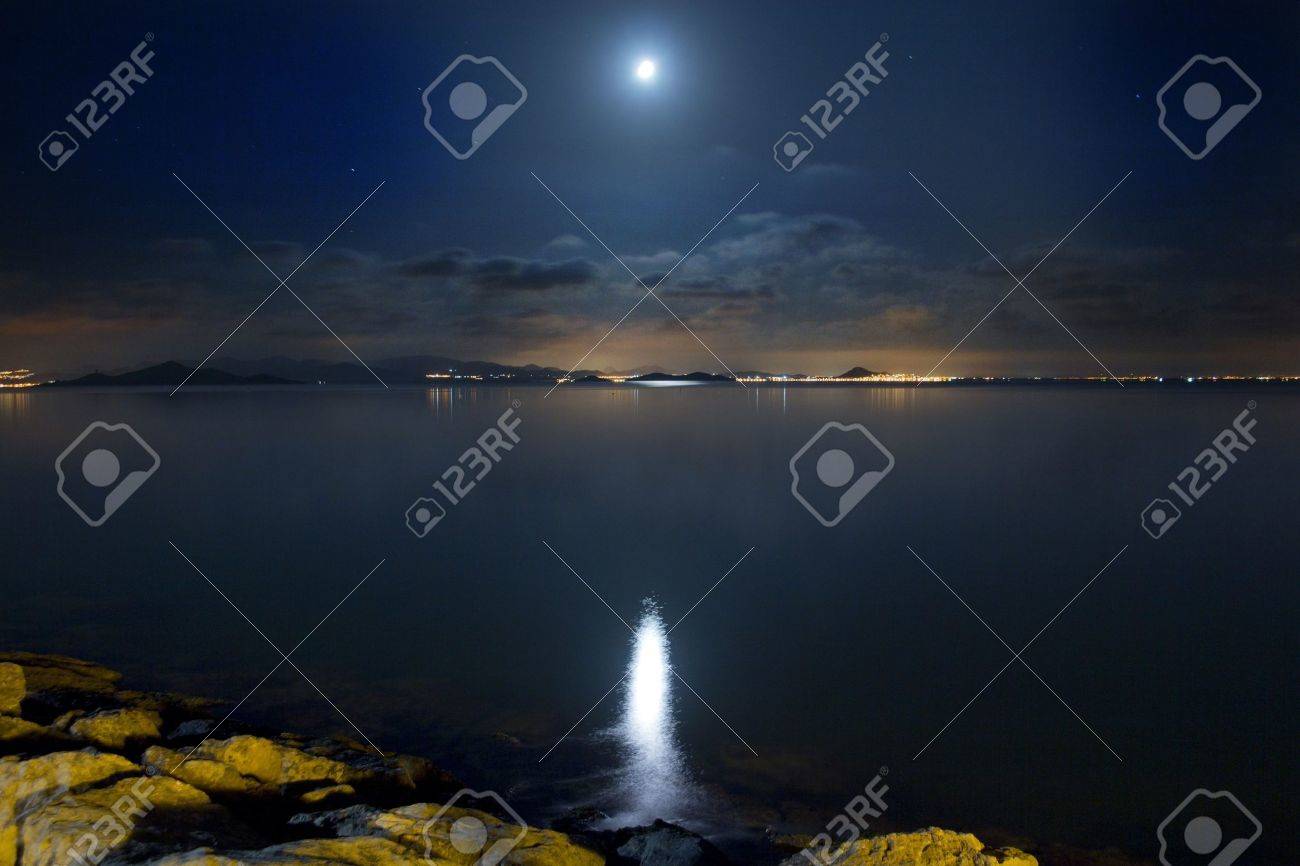 Night Scene beautiful sea and clouds illuminated by the moon - 11769228 Night Scene beautiful sea and clouds illuminated by the moon - 11769228