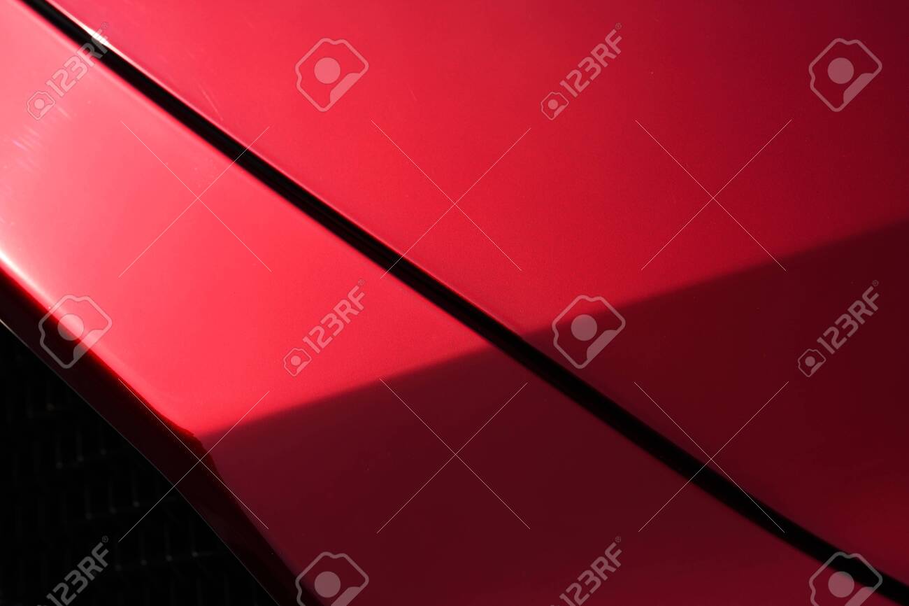Close up detail of red metallic paint coating car body - 129496384 Close up detail of red metallic paint coating car body - 129496384