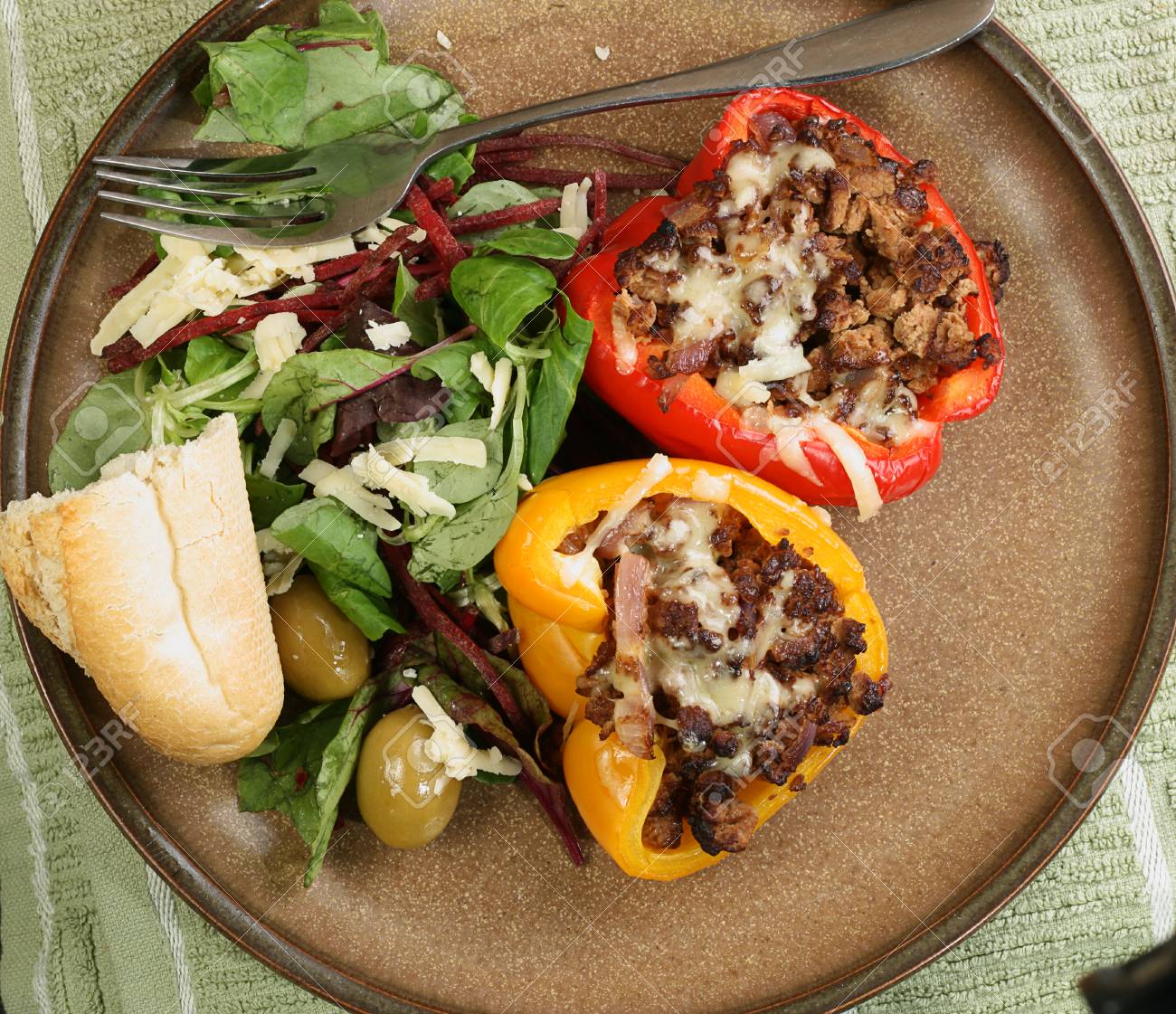 Two Roast Stuffed Peppers Wit Side Salad And Crusty Bread Stock Photo Picture And Royalty Free Image Image 84341475