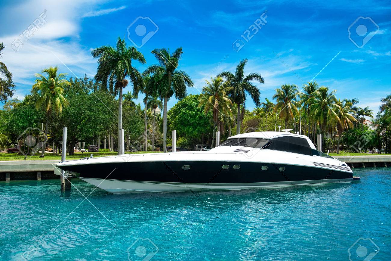Luxury speed yacht near tropical island in Miami, Florida - 48310603 Luxury speed yacht near tropical island in Miami, Florida - 48310603