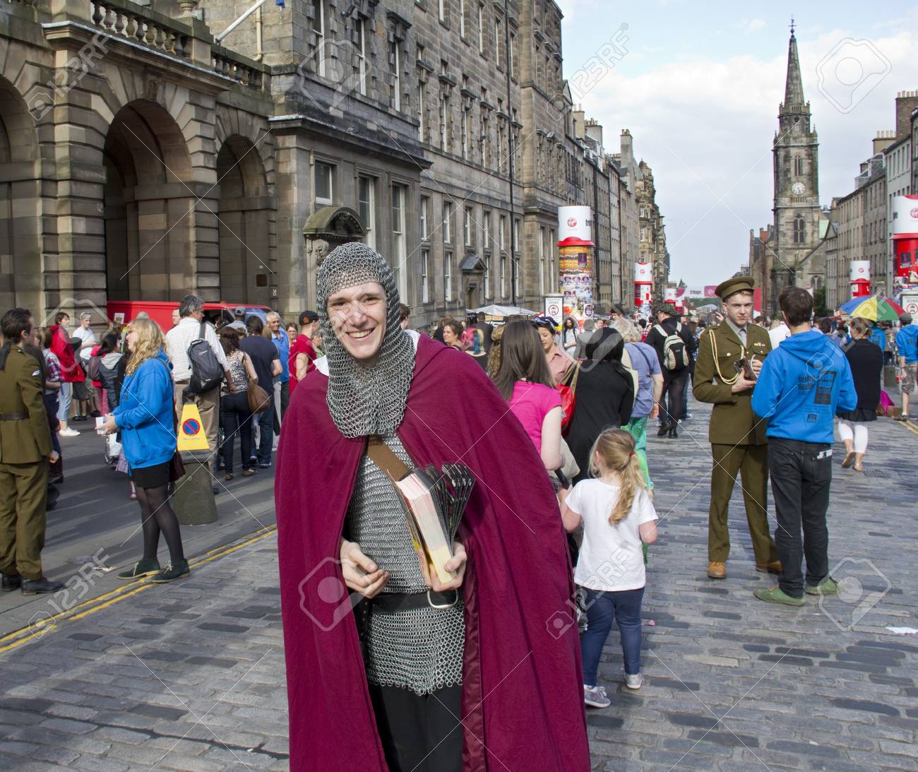 edinburgh uk august 2 unidentified man dressed as a medieval hand out flyers in uk