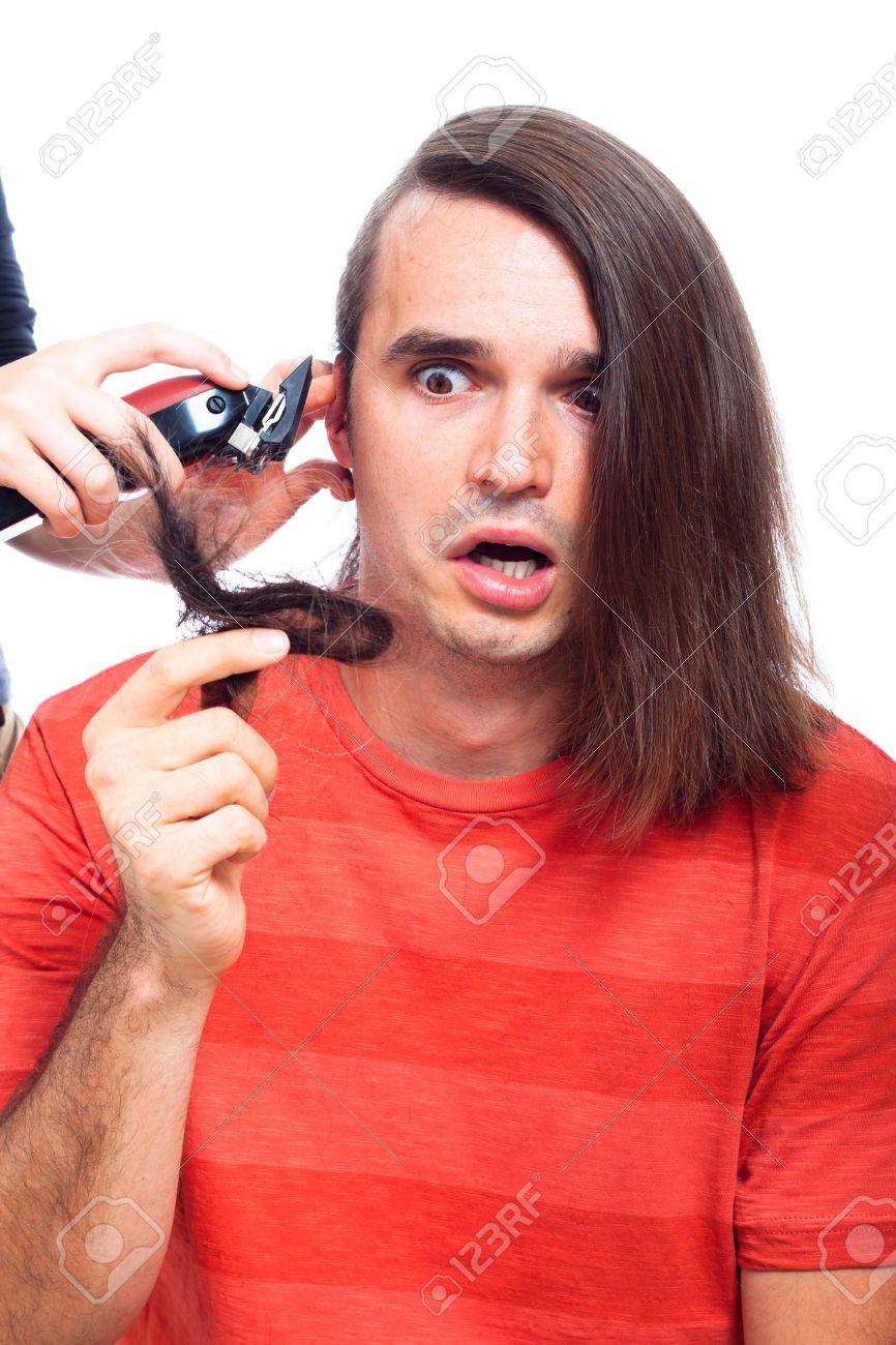 Shocked Long Haired Man Being Shaved With Hair Trimmer Isolated