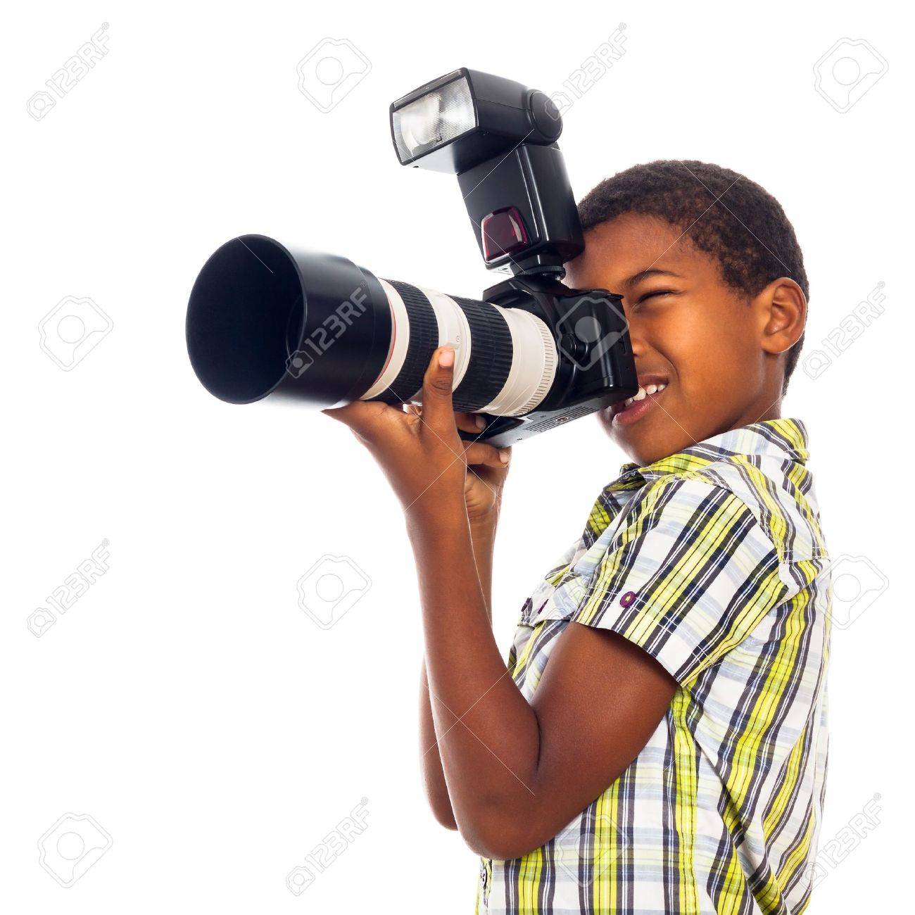 Child school boy taking photos with professional camera, isolated on white background. - 16959457 Child school boy taking photos with professional camera, isolated on white background. - 16959457