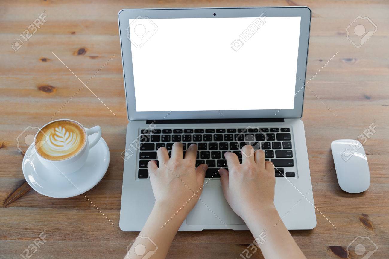 Closeup of business woman hand typing on laptop keyboard and coffee - 42941082 Closeup of business woman hand typing on laptop keyboard and coffee - 42941082